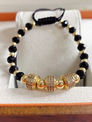 Bratara dama model deosebit cu margele negre cu auriu si cercuri cu pietricele stralucitoare