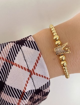 Bratara dama model deosebit cu margele aurii si coroana cu pietricele albe