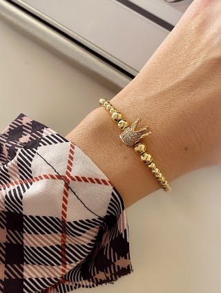 Bratara dama model deosebit cu margele aurii si coroana cu pietricele albe