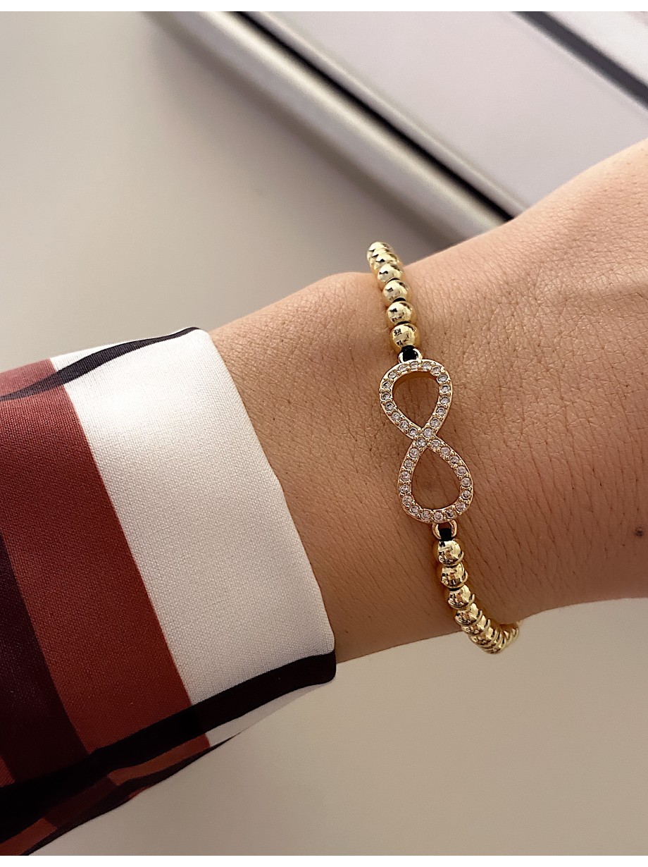 Bratara dama model deosebit cu margele aurii si infinit cu pietricele stralucitoare