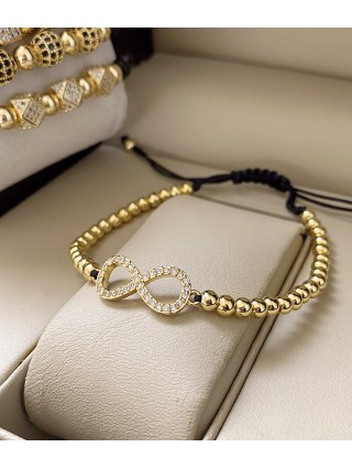 Bratara dama model deosebit cu margele aurii si infinit cu pietricele stralucitoare