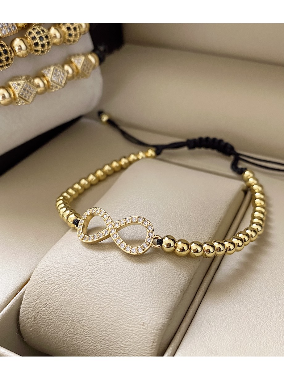 Bratara dama model deosebit cu margele aurii si infinit cu pietricele stralucitoare