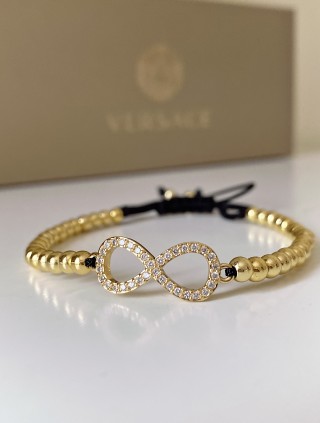 Bratara dama model deosebit cu margele aurii si infinit cu pietricele stralucitoare