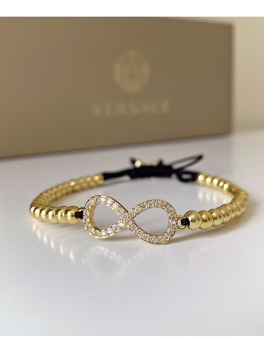 Bratara dama model deosebit cu margele aurii si infinit cu pietricele stralucitoare