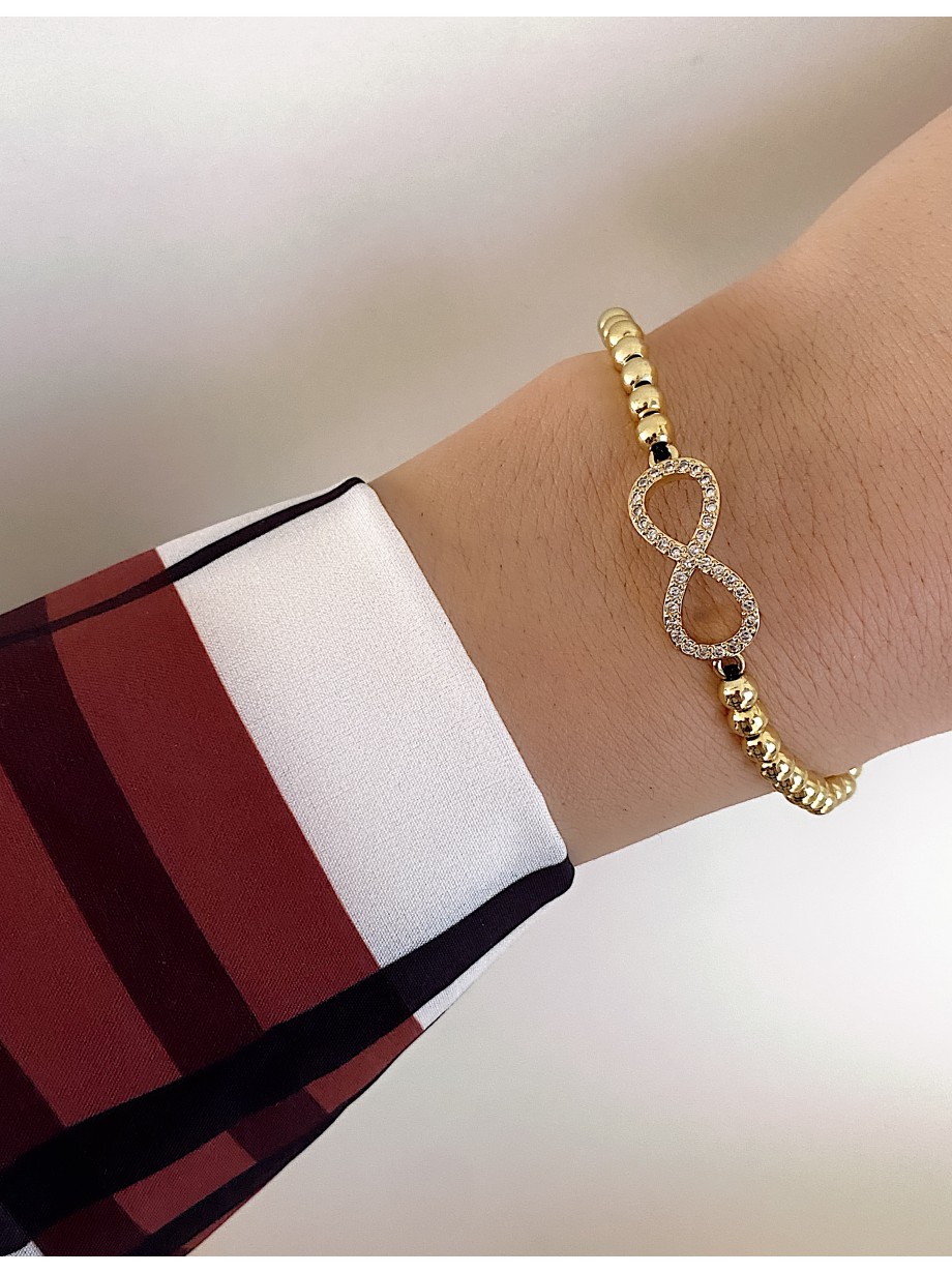 Bratara dama model deosebit cu margele aurii si infinit cu pietricele stralucitoare