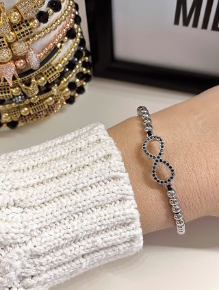 Bratara dama model deosebit cu margele aurii si infinit cu pietricele stralucitoare