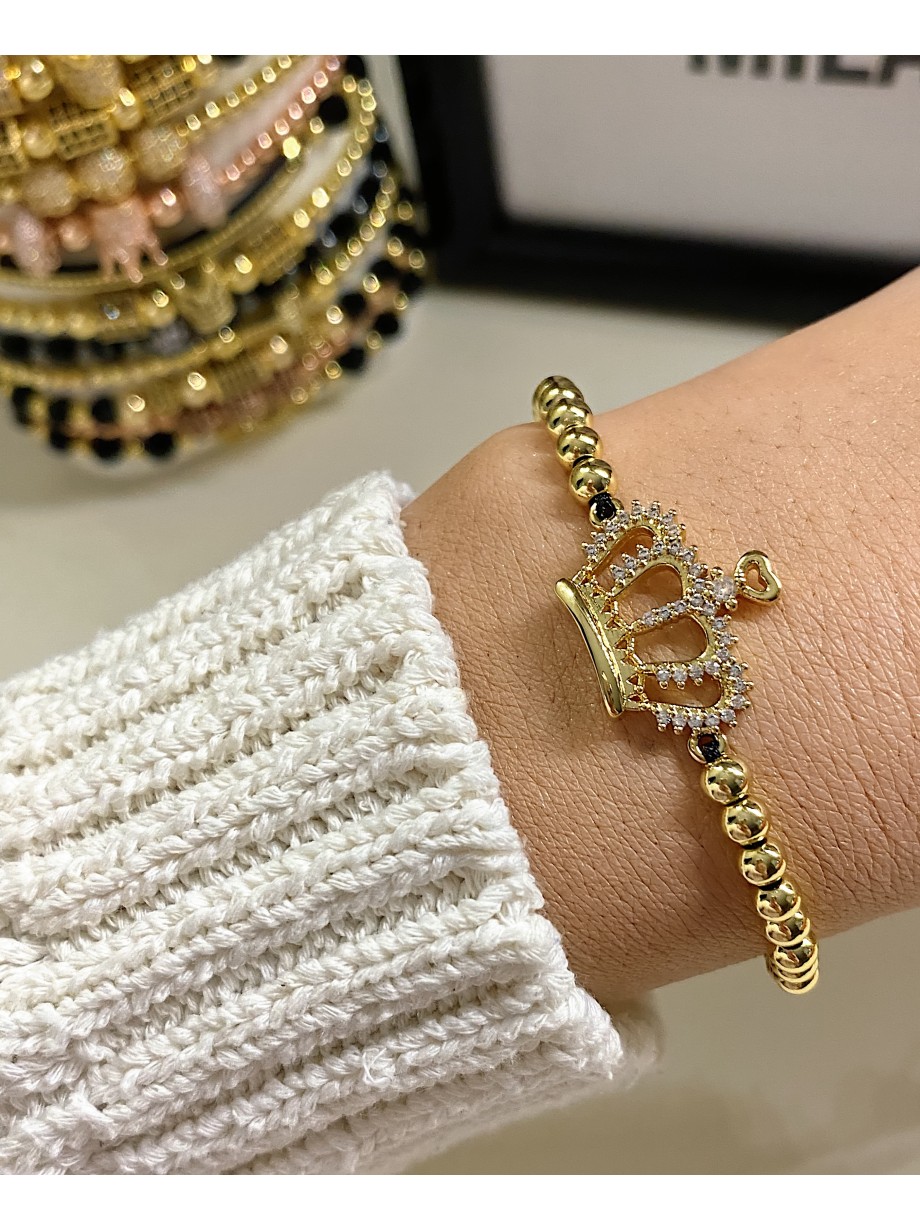 Bratara dama model deosebit cu margele aurii si coroana cu pietricele stralucitoare