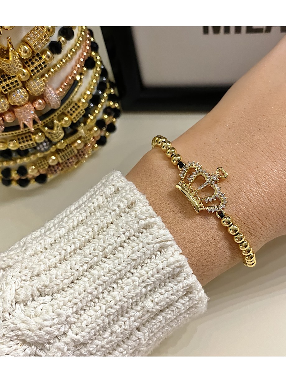 Bratara dama model deosebit cu margele aurii si coroana cu pietricele stralucitoare