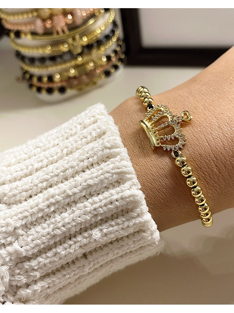 Bratara dama model deosebit cu margele aurii si coroana cu pietricele stralucitoare