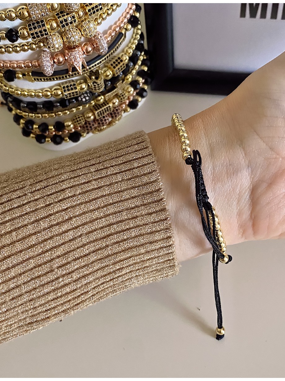 Bratara dama model deosebit cu margele aurii si palma cu pietricele negre