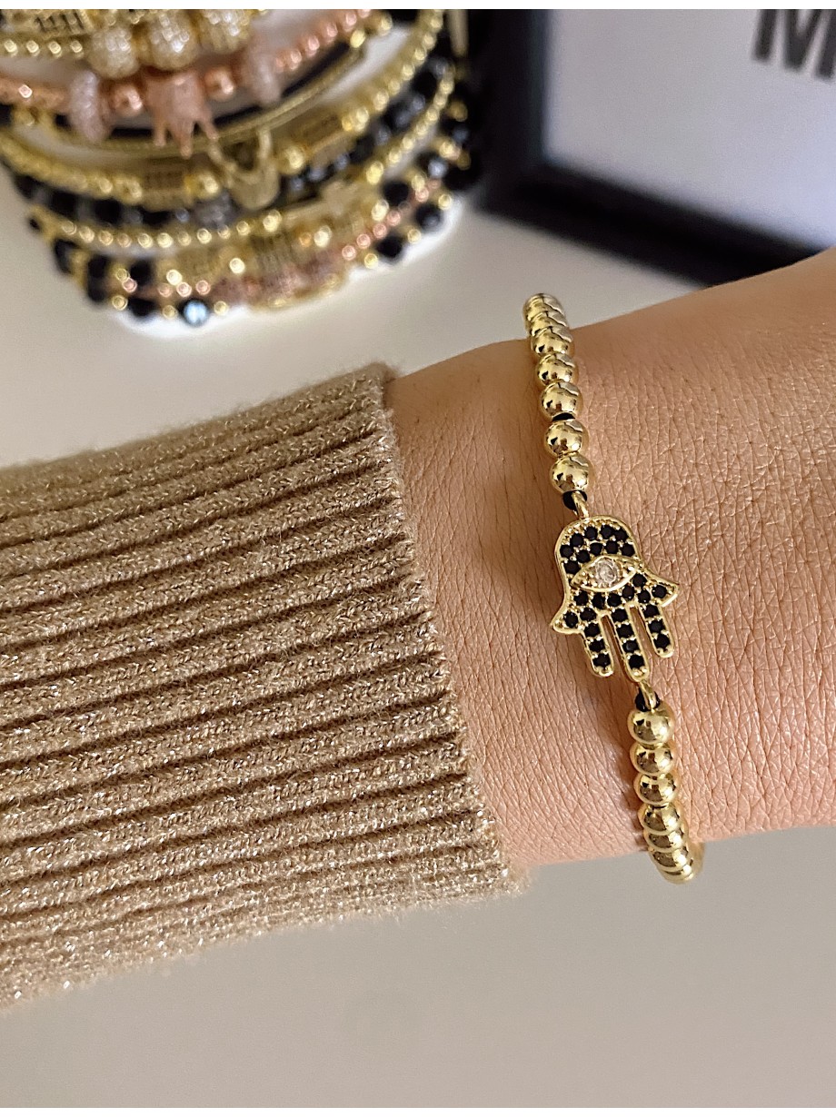 Bratara dama model deosebit cu margele aurii si palma cu pietricele negre