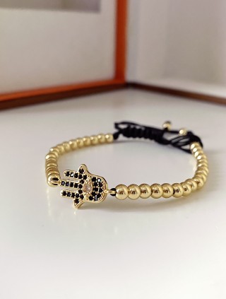 Bratara dama model deosebit cu margele aurii si palma cu pietricele negre