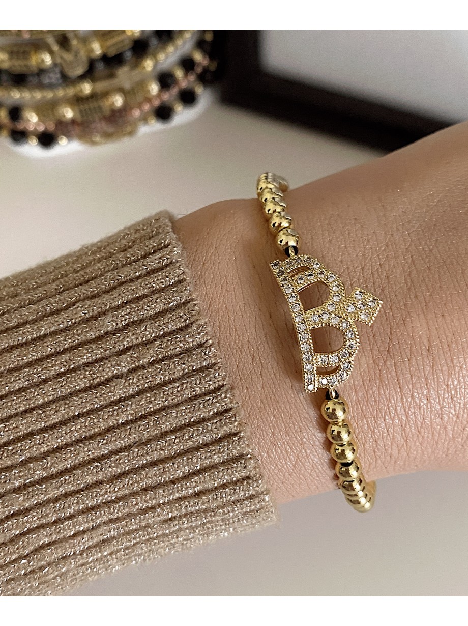 Bratara dama model deosebit cu margele aurii si coroana cu pietricele stralucitoare