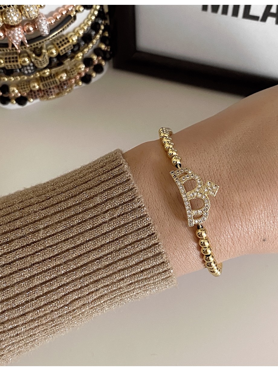 Bratara dama model deosebit cu margele aurii si coroana cu pietricele stralucitoare