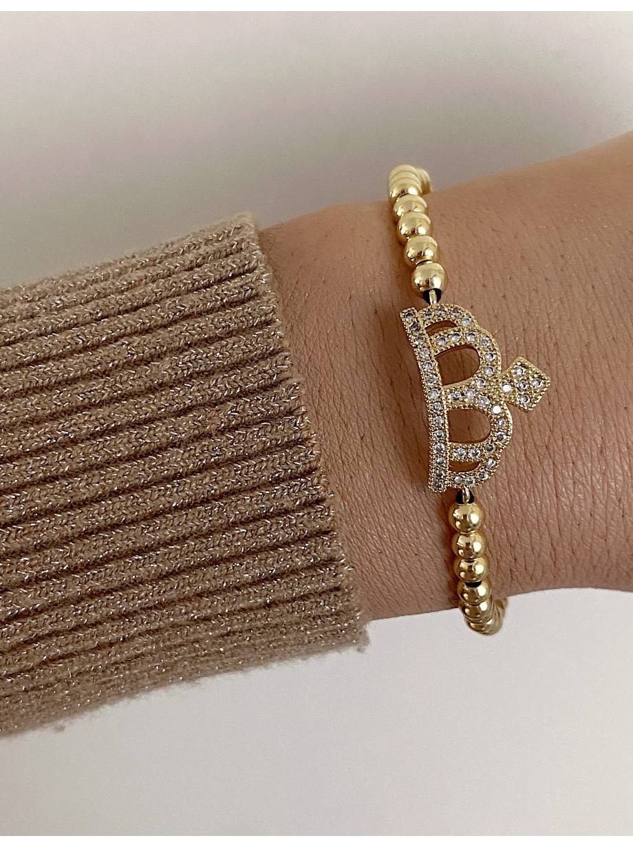 Bratara dama model deosebit cu margele aurii si coroana cu pietricele stralucitoare