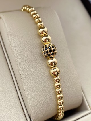 Bratara dama model deosebit cu margele aurii si biluta cu pietricele negre