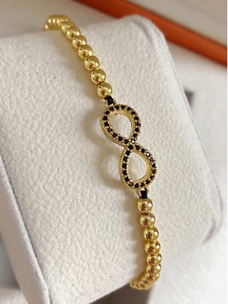 Bratara dama model deosebit cu margele aurii si infinit cu pietricele negre