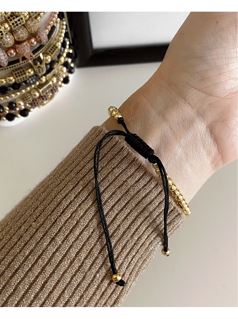 Bratara dama model deosebit cu margele aurii si infinit cu pietricele negre