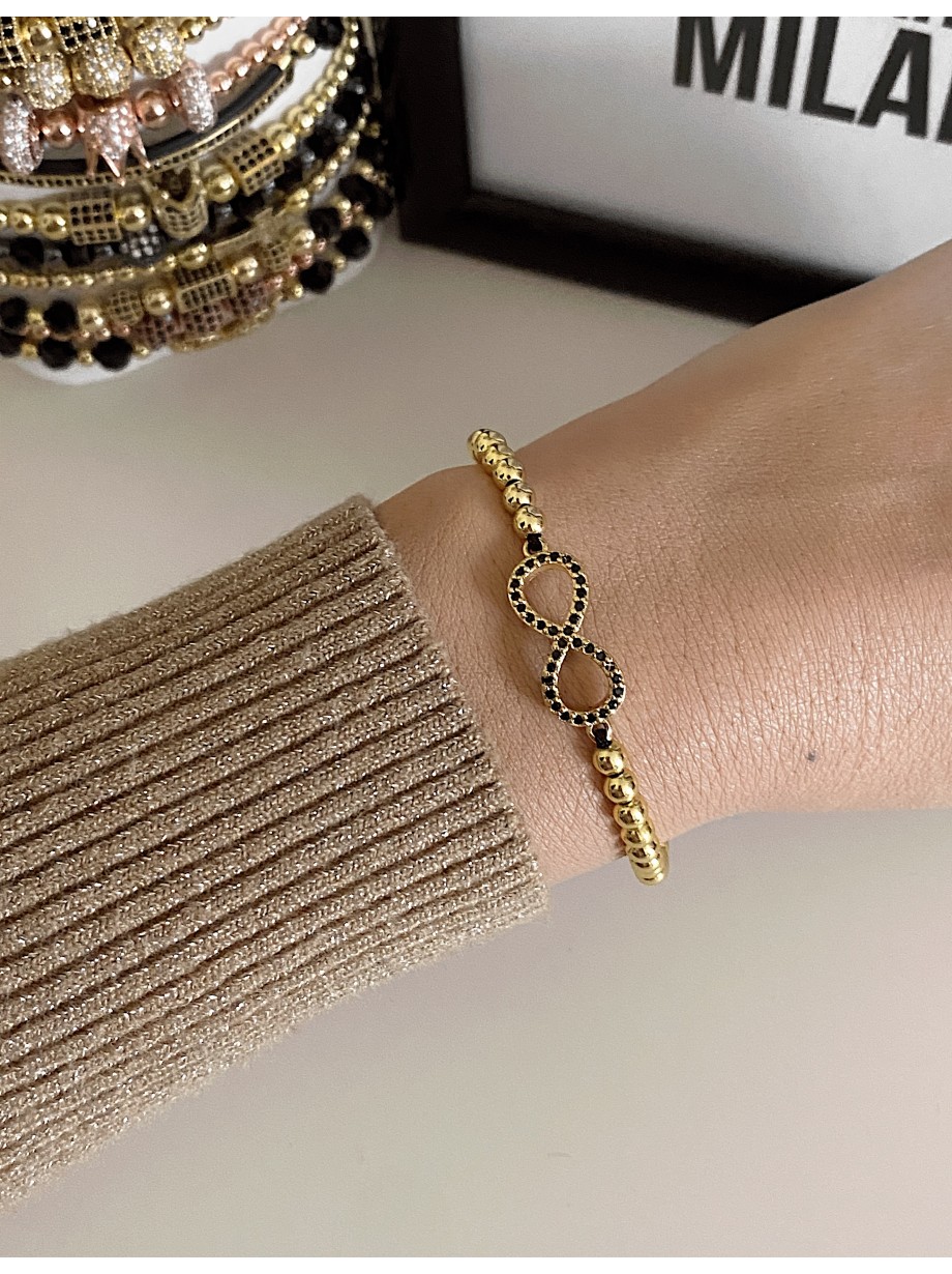 Bratara dama model deosebit cu margele aurii si infinit cu pietricele negre