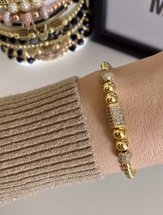 Bratara dama model deosebit cu margele aurii si forme cu pietricele stralucitoare