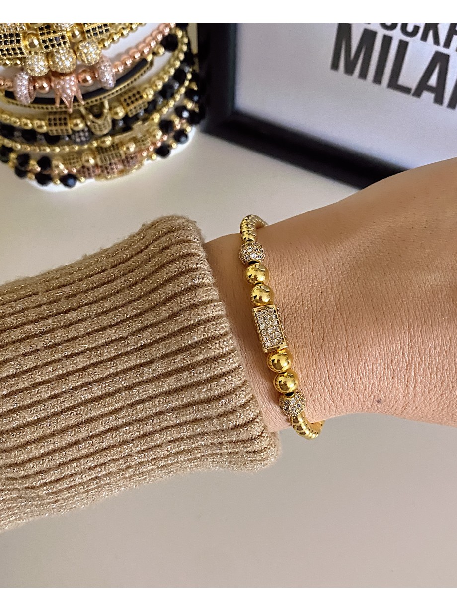 Bratara dama model deosebit cu margele aurii si forme cu pietricele stralucitoare