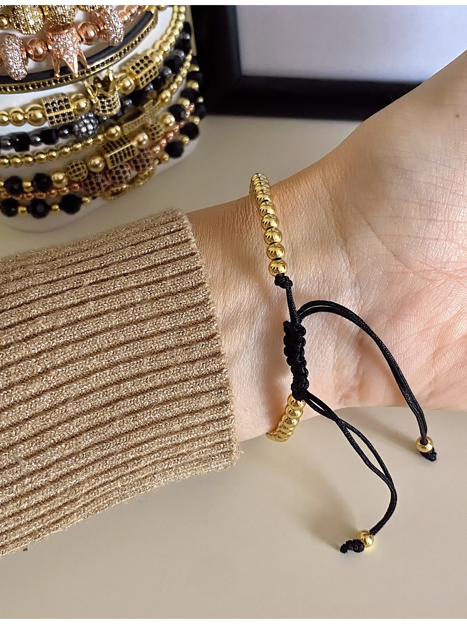 Bratara dama model deosebit cu margele aurii si biluta cu pietricele negre