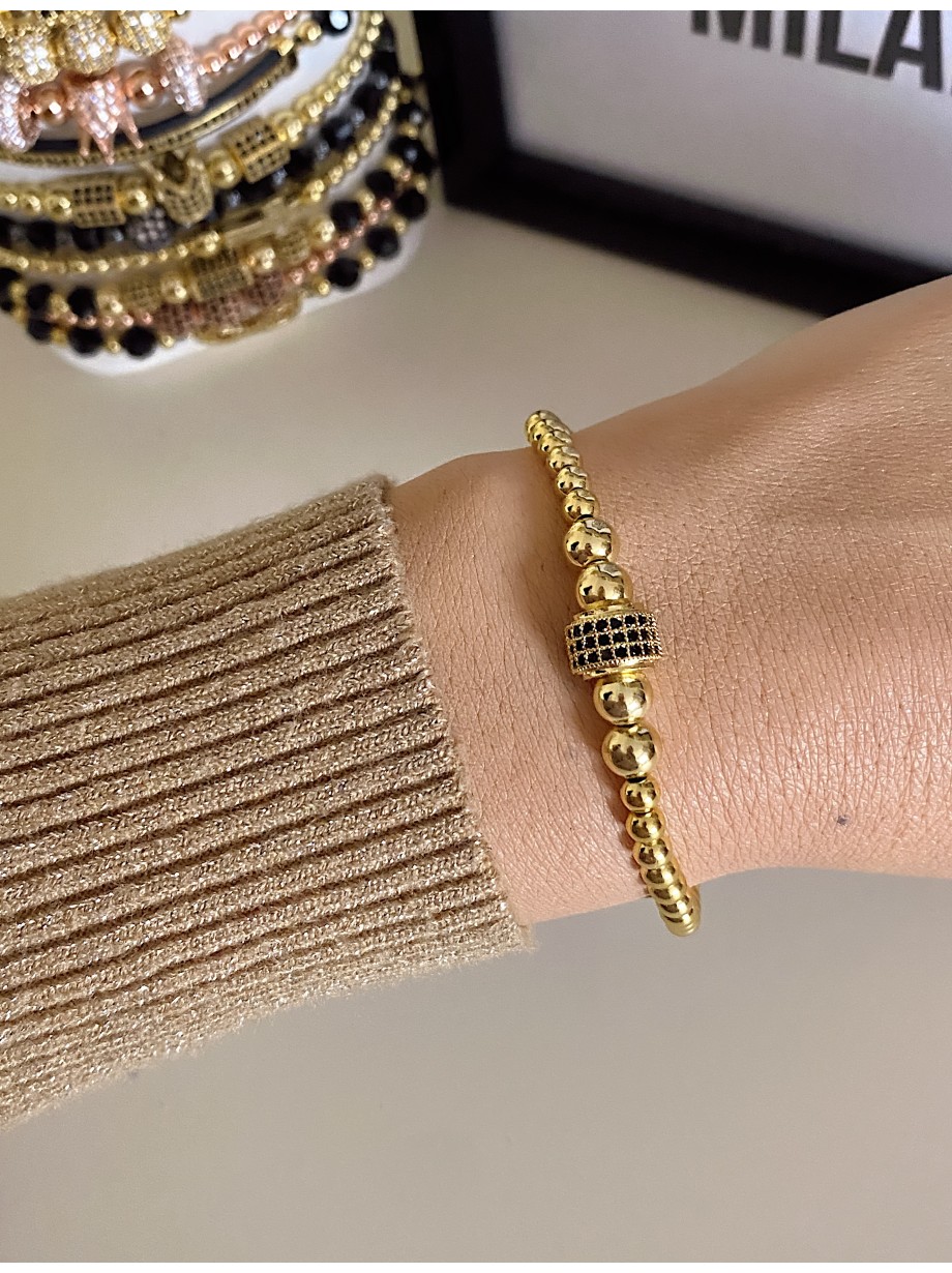 Bratara dama model deosebit cu margele aurii si biluta cu pietricele negre