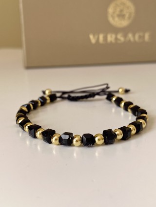 Bratara dama model deosebit cu margele aurii si negre simpla