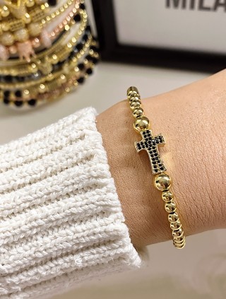 Bratara dama model deosebit cu margele aurii si cruce cu pietricele negre