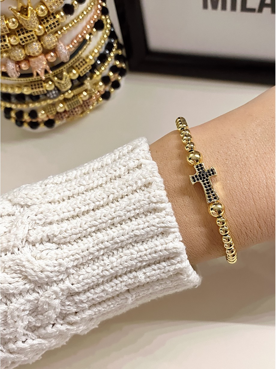 Bratara dama model deosebit cu margele aurii si cruce cu pietricele negre