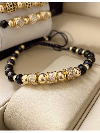 Bratara dama model deosebit cu margele aurii si negre si cercuri cu pietre stralucitoare