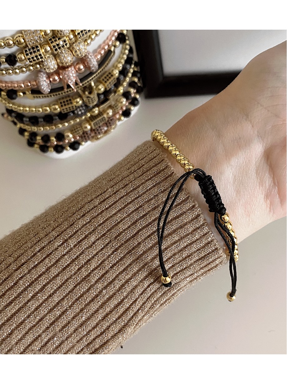 Bratara dama model deosebit cu margele aurii si cruciulita cu pietricele stralucitoare