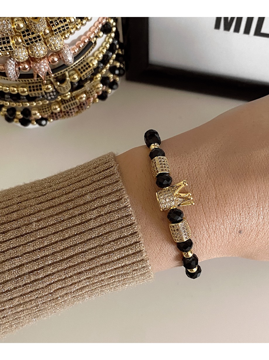 Bratara dama model deosebit cu margele aurii si negre si coroana cu pietricele albe