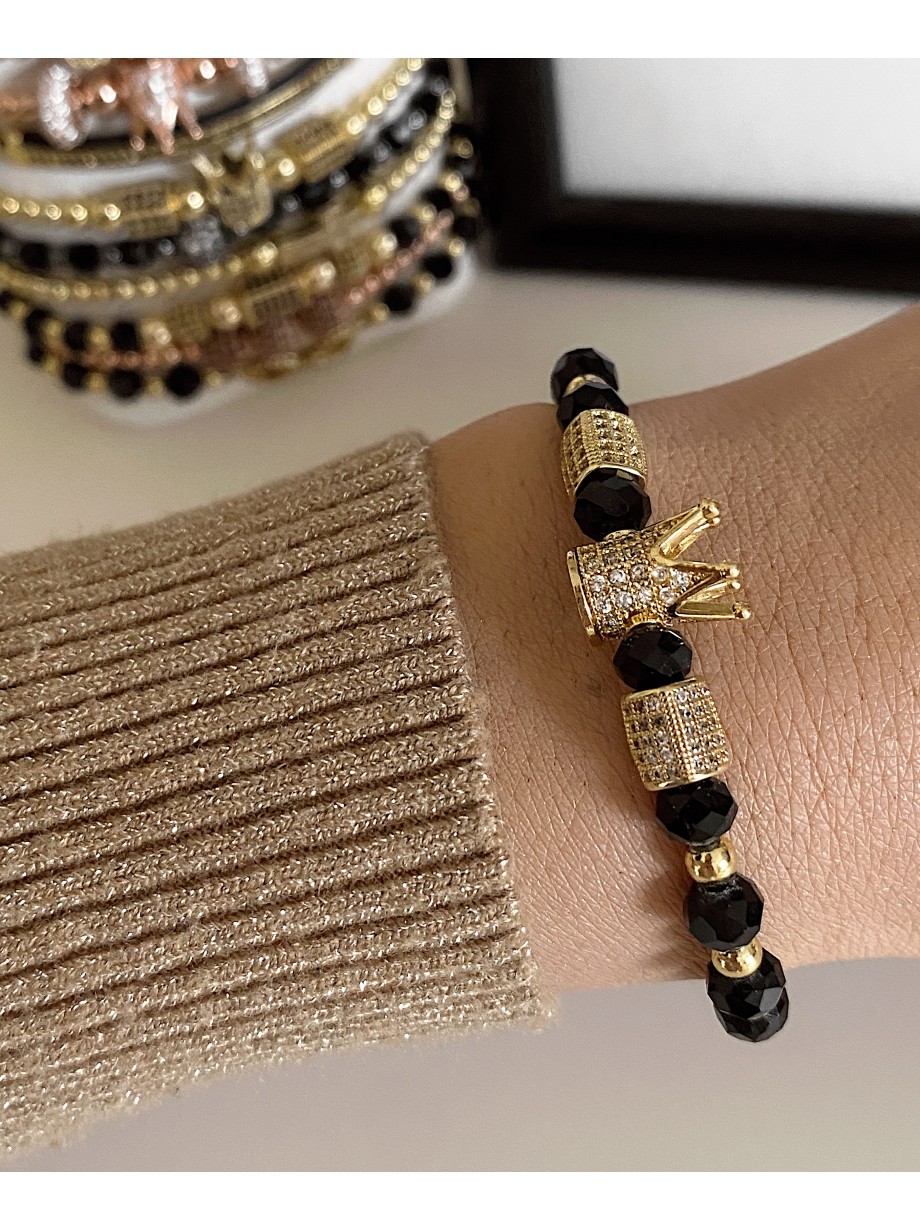 Bratara dama model deosebit cu margele aurii si negre si coroana cu pietricele albe