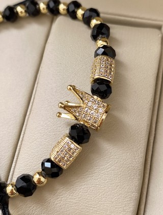 Bratara dama model deosebit cu margele aurii si negre si coroana cu pietricele albe