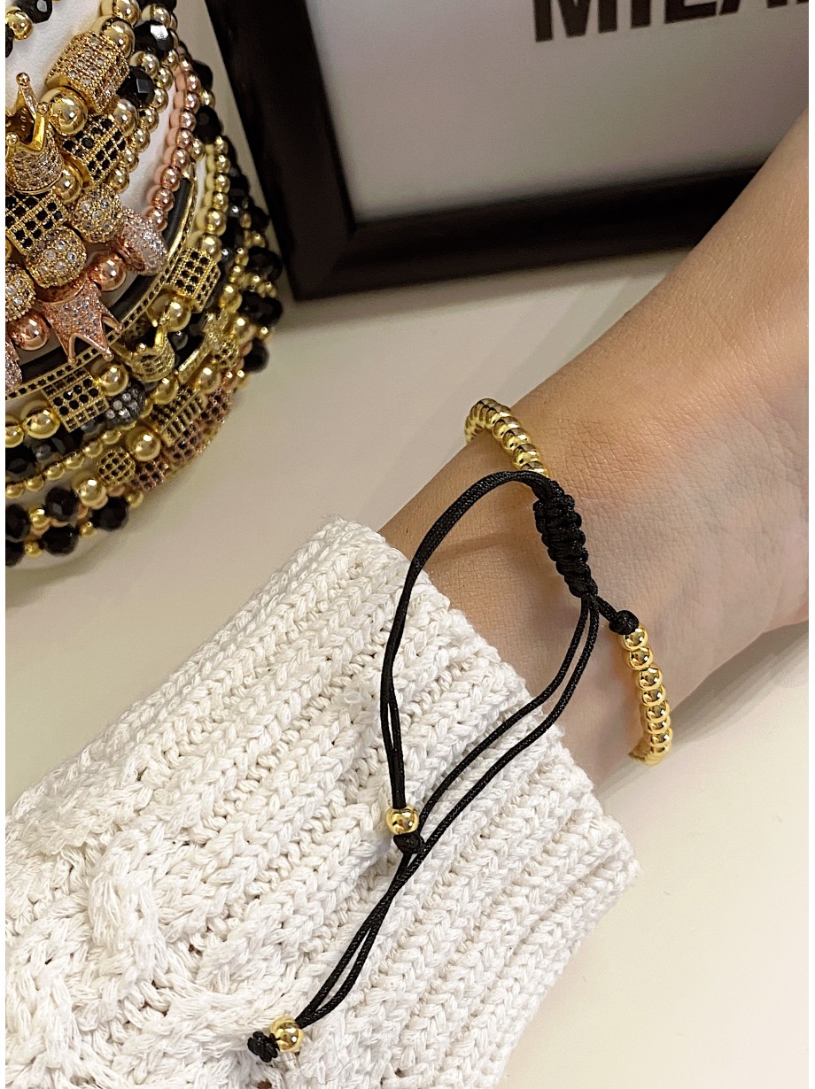 Bratara dama model deosebit cu margele aurii si craniu auriu