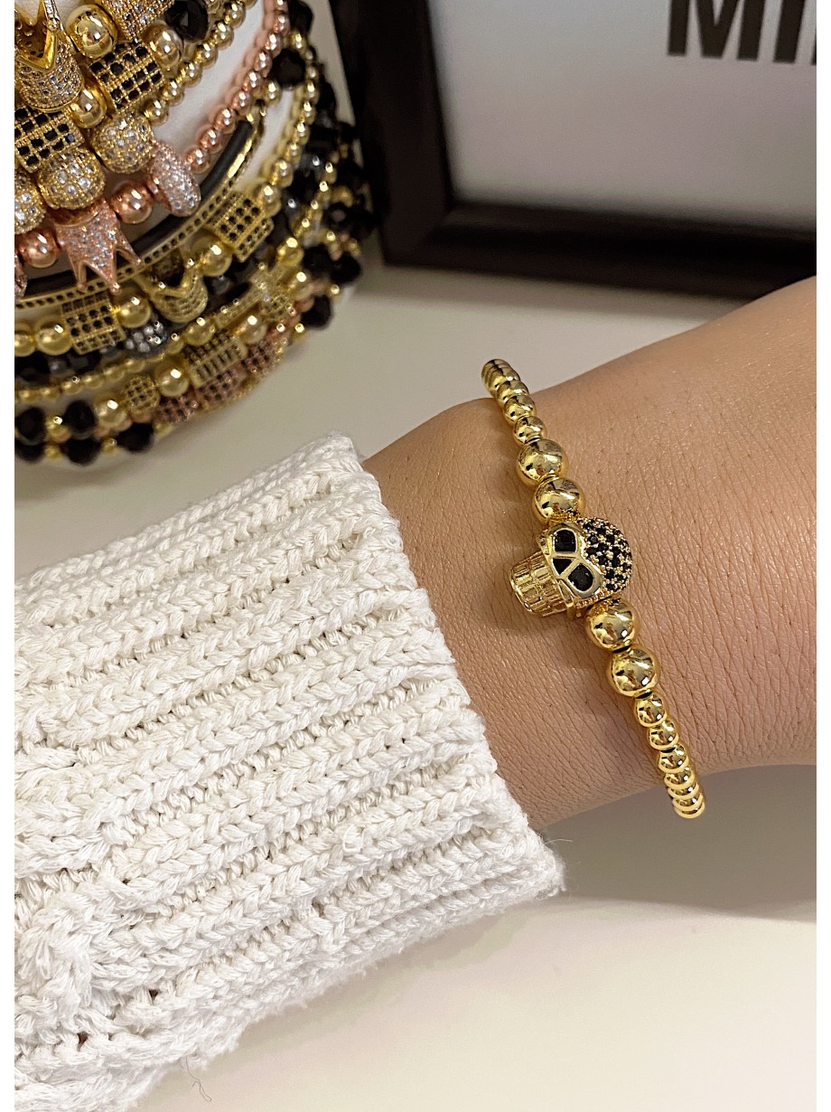 Bratara dama model deosebit cu margele aurii si craniu auriu