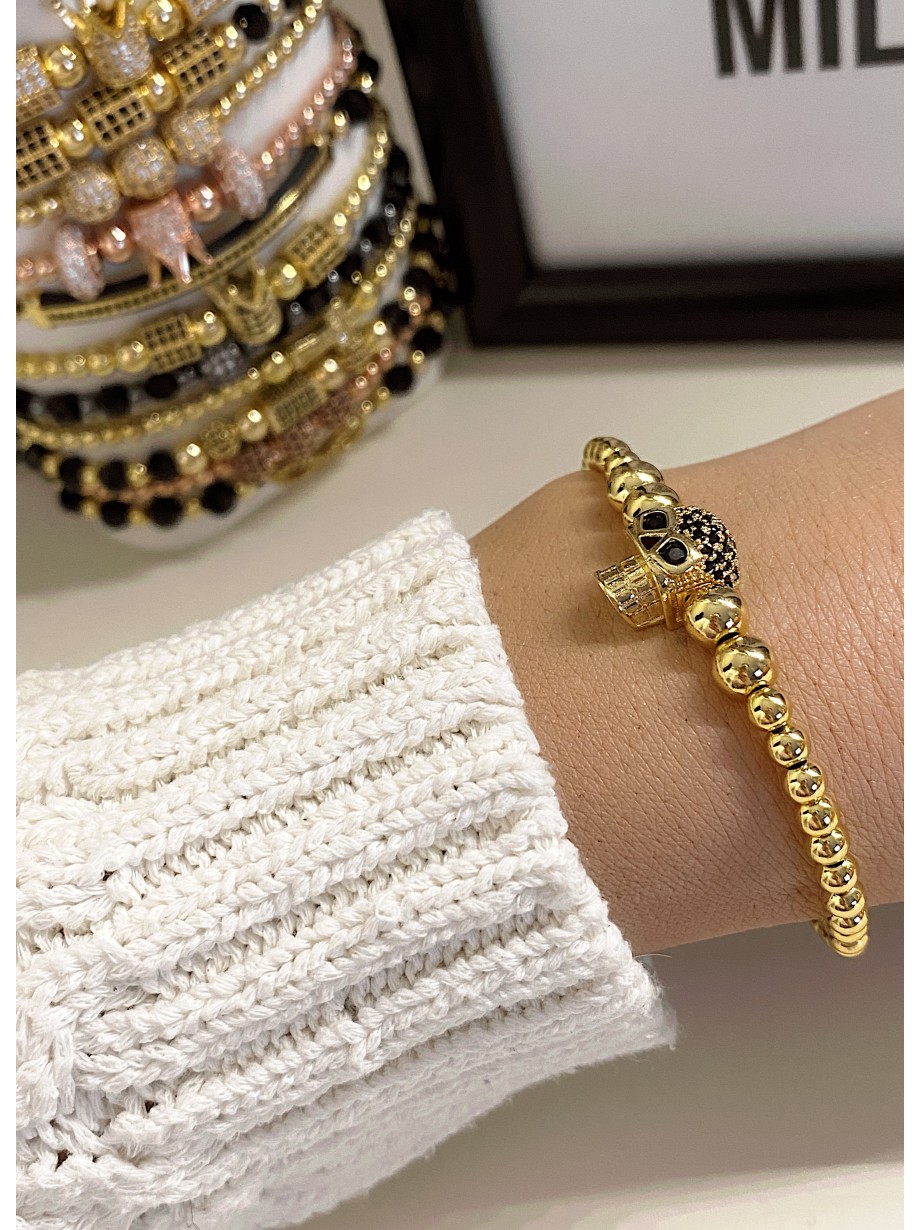 Bratara dama model deosebit cu margele aurii si craniu auriu