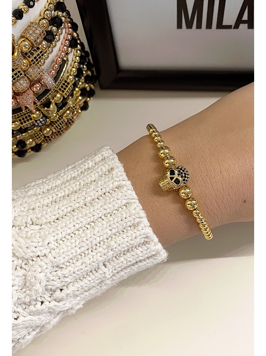 Bratara dama model deosebit cu margele aurii si craniu auriu