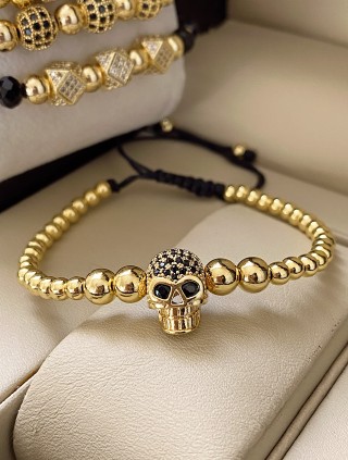 Bratara dama model deosebit cu margele aurii si craniu auriu