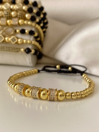 Bratara dama model deosebit cu margele aurii si cercuri cu pietricele stralucitoare