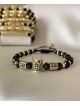 Bratara dama model deosebit cu margele aurii si negre si coroana cu pietricele negre