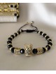 Bratara dama model deosebit cu margele aurii si negre si coroana cu pietricele negre