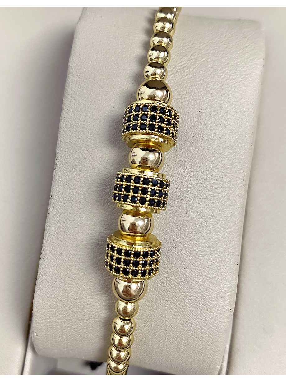 Bratara dama model deosebit cu margele aurii si cercuri cu pietricele negre