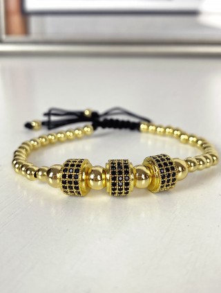 Bratara dama model deosebit cu margele aurii si cercuri cu pietricele negre