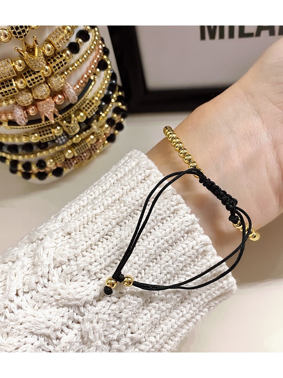 Bratara dama model deosebit cu margele aurii si forme cu pietricele negre