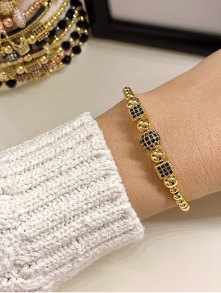 Bratara dama model deosebit cu margele aurii si forme cu pietricele negre