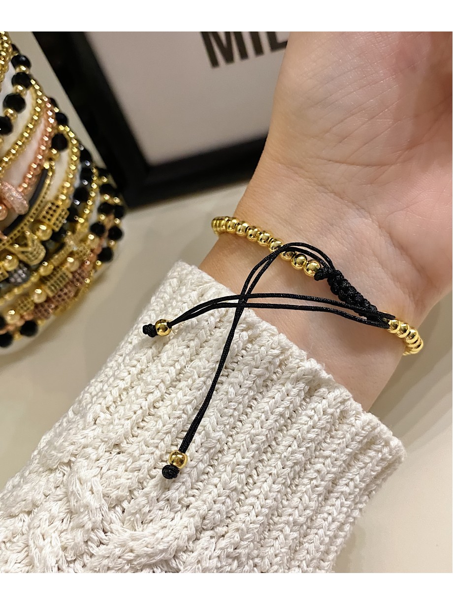 Bratara dama model deosebit cu margele aurii si patrate cu pietricele negre