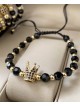 Bratara dama model deosebit cu margele aurii si negre si coroana cu pietricele negre