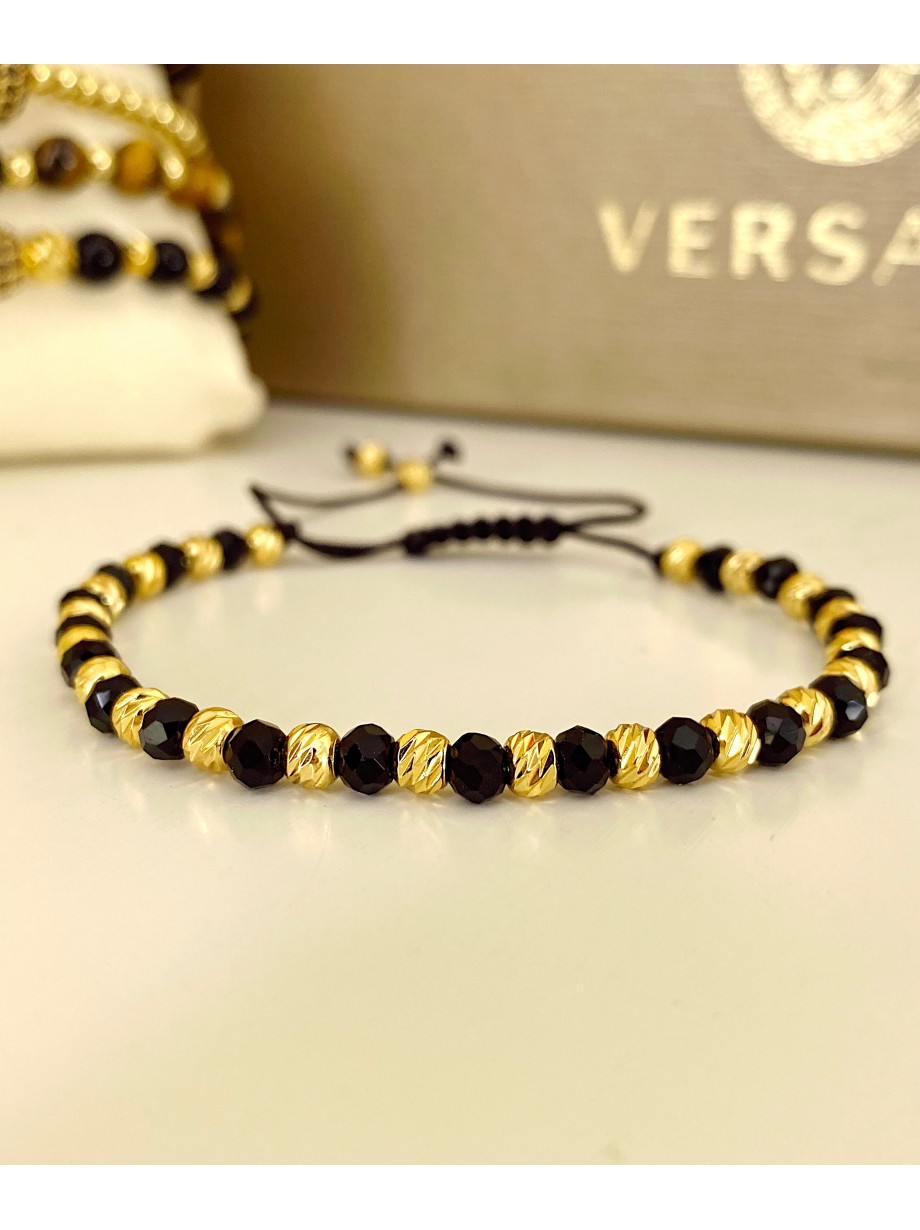 Bratara dama model deosebit cu margele aurii si negre simpla